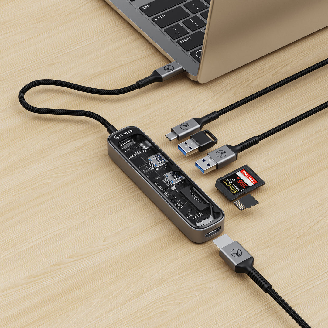USB hub connected to a laptop on a wooden surface